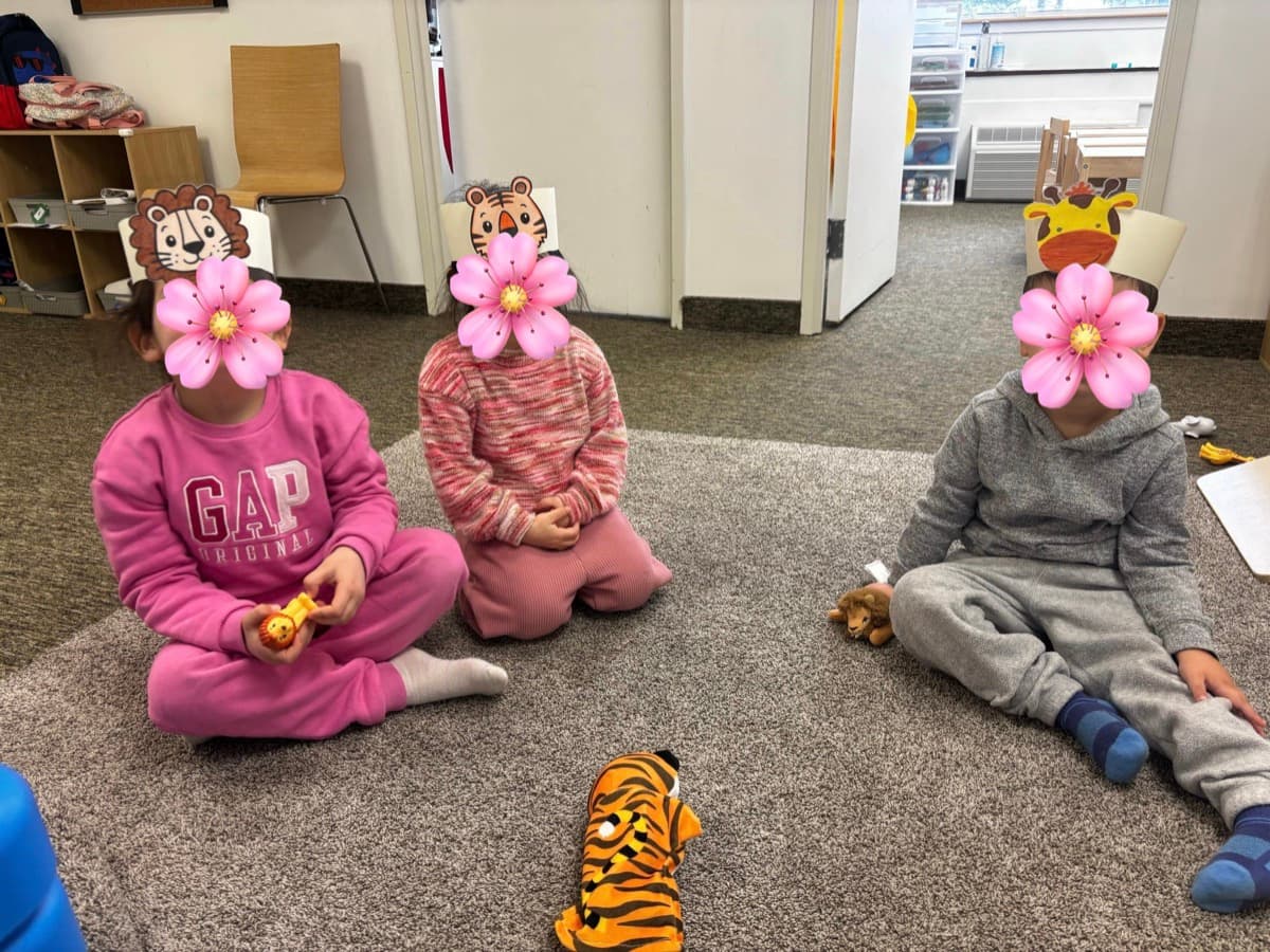 Children learning with clothespin activity at the chalkboard